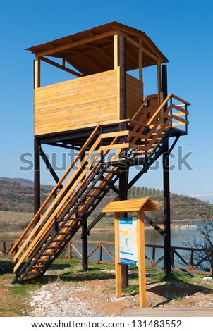 Bird watching tower and informative billboard in a protected wetland