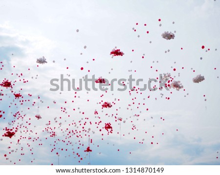 Balloons on blue sky background