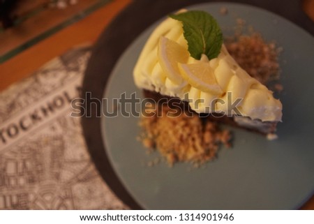 Background picture of lemon tart with crunchy crumbles at Italian restaurant by selective focus 