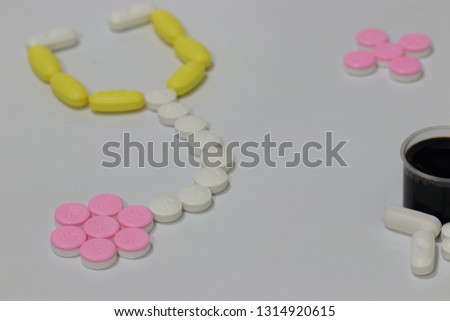 Assorted colorful pharmaceutical medicine pills, tablets and capsules on white background. Pharmacy theme, health care, drug prescription for treatment medication and pharmaceutical medicament