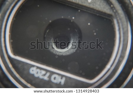 Macro shot of a dusty 720p HD desktop or laptop pc computer webcam lens. Privacy and spy concept Royalty-Free Stock Photo #1314928403