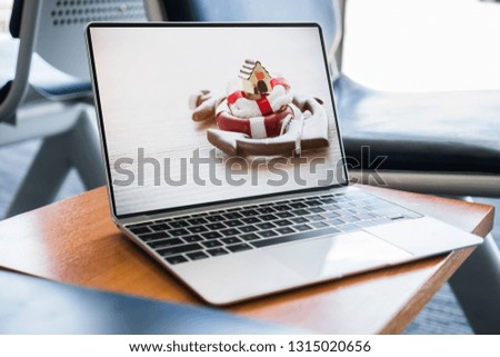 Insurance services loan debt Property House protection concept. Home on red lifebuoy anchor on wood Background in notebook screen display. Strategy for safe secure wealth from risk claims real estate