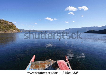 Landscape of the beautiful outdoor view with boat at the coast in Lugu Lake, Yunnan, China