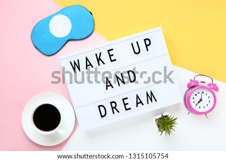 Lightbox with words Wake Up And Dream on colorful background