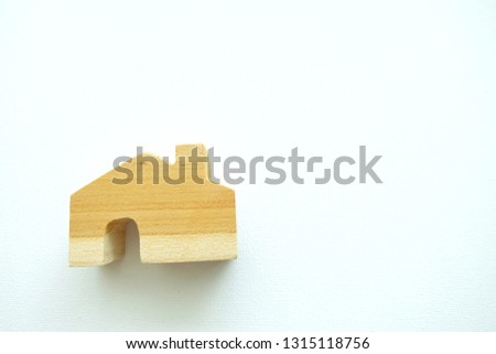 Close up of mini house on white background