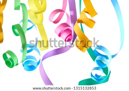 Colorful serpentines in close-up on a white background
