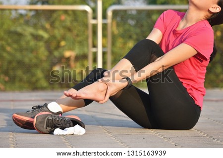 Female runner suffering with pain on sports running injury Royalty-Free Stock Photo #1315163939