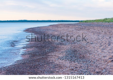 relaxing picture of stony beach and calm sea