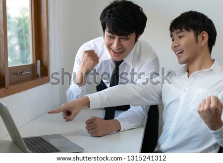 Business male couple working at home office