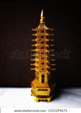 miniature gold-colored temples made of iron.