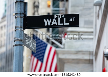 Directional Sign Board Of Wall Street In New York City