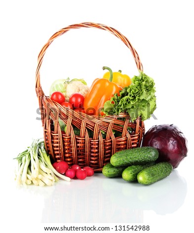Fresh vegetables in wicker basket  isolated on white