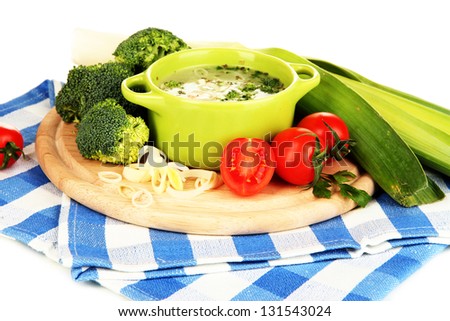 Diet soup with vegetables in pan isolated on white