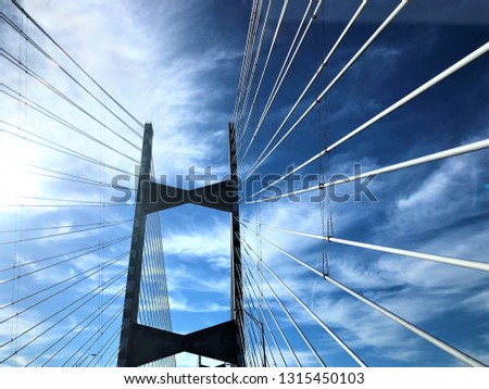 Cable bridge across St.Johns River on the blue sky white clouds and the sunlight, Winter in Jacksonville, Florida USA.