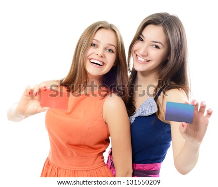 beautiful friendly smiling confident young women showing club cards in hands, over white background
