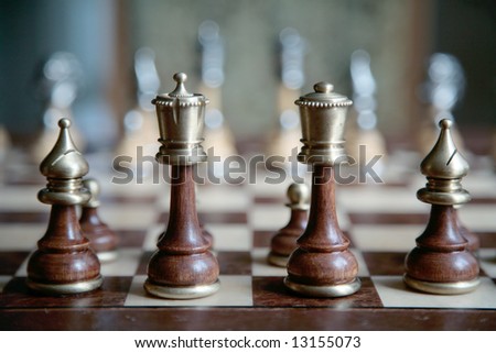 lined up in a row figures on chess-board