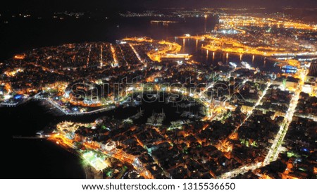 Aerial drone night shot of illuminated famous port of Piraeus and Marina Zeas, Attica, Greece