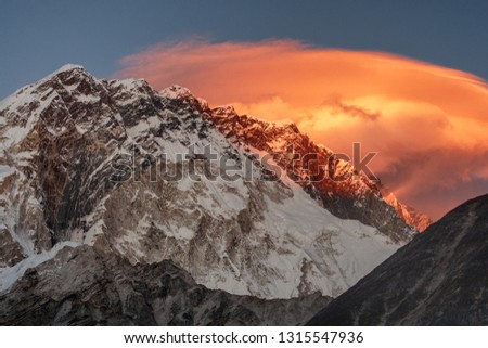Fragment of the wall Nuptse in the rays of the sun, Everest region, Nepal