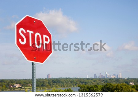 Stop Sign With City Skyline