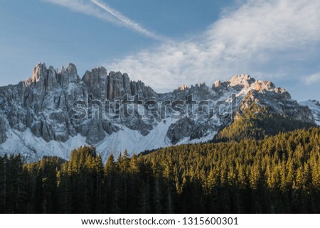 Panoramic view of mountains above Lago Di Carezza in South Tyrol in Northern Italian Dolomites during the fall. 