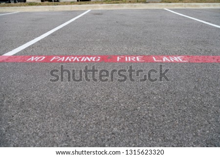 View of Open Parking Spaces With Cars parked on the Other Size