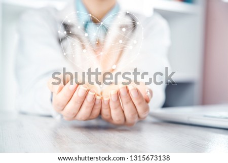 woman doctor hand heart in screen