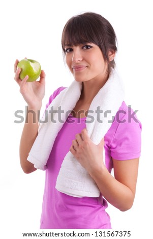Young caucasian woman eating  an apple over white background