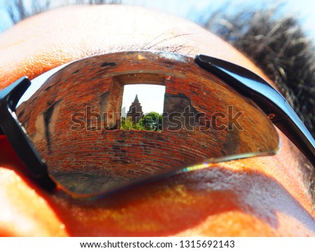 The reflection on a traveller's sunglasses at The Wat Ratchaburana, Ayutthaya, Thailand. This place also be one of ayutthaya historical park.
