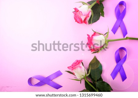 International Women's Day, March 8, flat lay arrangement of roses and purple ribbons on pink wood table background with lens flare.
