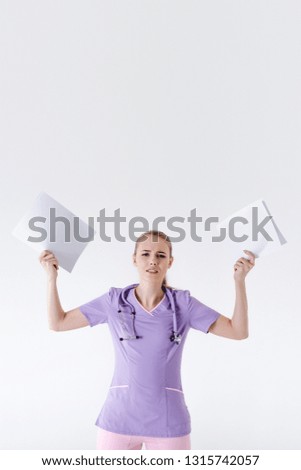 Woman doctor blonde young light gray background studio day beautiful one furious screaming scattering paper documents reports no time tired work low pay.