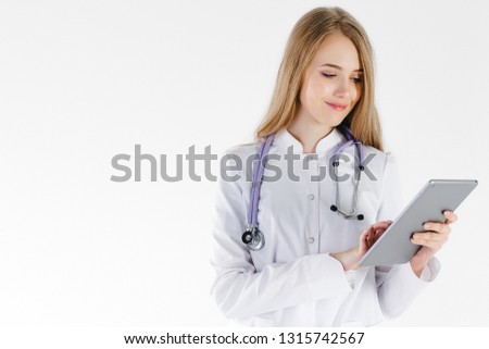 Girl doctor blond young light background studio day beautiful one positive tablet looking smiling concept of remote customer care online patients.