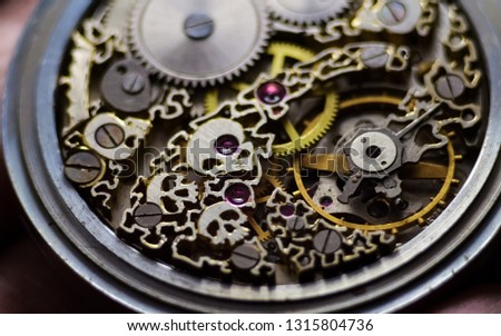 Skeleton of vintage handmade antique mechanical pocket watches, clockwork old mechanical watch, high resolution and detail, winter time and summer time concept. selective focus.