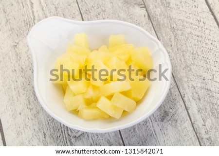 Marinated pineapple pieces in the bowl