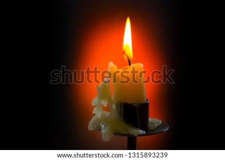Candle Light flame on black background 