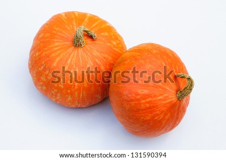 Fresh orange pumpkins isolated on white background.