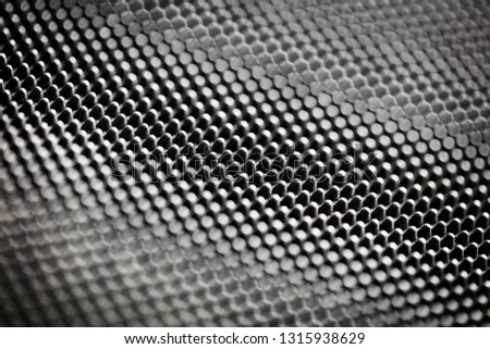 Black bumpy rubber surface used as a background. Black and white texture of rubber material with copy space. Bubble dots background pattern. Studio macro photography.  Royalty-Free Stock Photo #1315938629