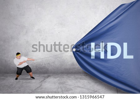 Picture of a young fat man wearing sportswear while using a chain to pull HDL word in the banner