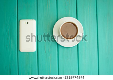 Coffee, coffee in a bag, a cup of coffee, coffee with milk, cheerfulness, caffeine, energy, background, latte, cappuccino, espresso, cinnamon, business, business breakfast, smartphone