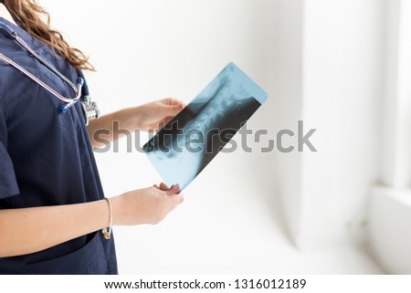 A doctor with his stethoscope and snapshot. clinic banner panoramic crop for copy space. medical background