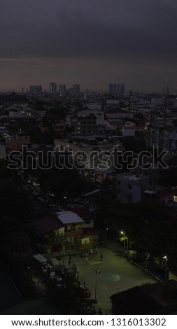 Aerial View of Manila Urban Cityscape with Basketball Court