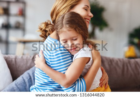 happy mother's day! a child daughter   hugs and congratulates mother 
