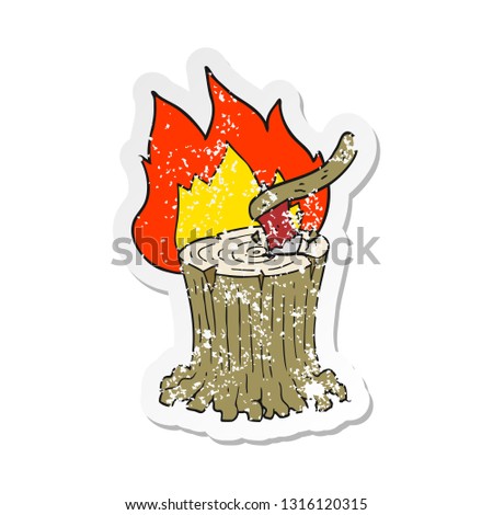 retro distressed sticker of a cartoon axe in flaming tree stump