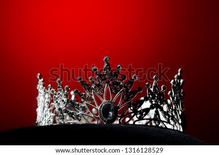 Silver Diamond Crown of Miss Pageant Beauty Universe World Contest sparkle light on black pillow, ready for wear Most beautiful Winner, studio lighting super red gradient background dramatic