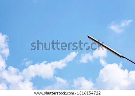 Street lamps with bright blue sky and cloud