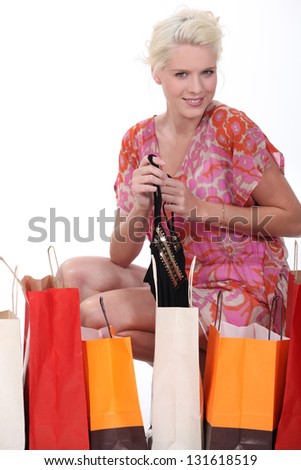 blonde woman and many carton bags