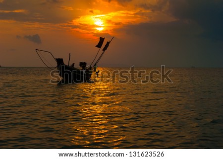 Sea boat art photography. Sunset sun with dramatic clouds