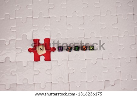 AUTISM alphabets on jigsaw puzzles. Conceptual Photo.