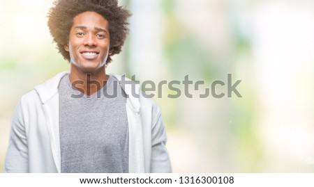 Afro american man wearing sweatshirt over isolated background with a happy and cool smile on face. Lucky person.