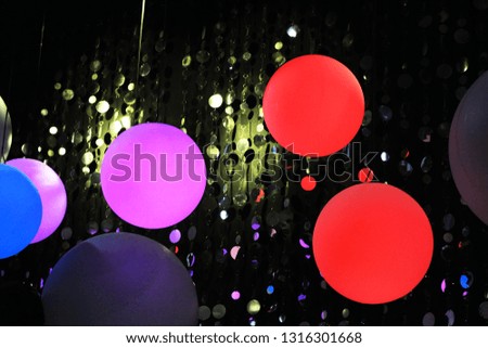 red balloon on black background.