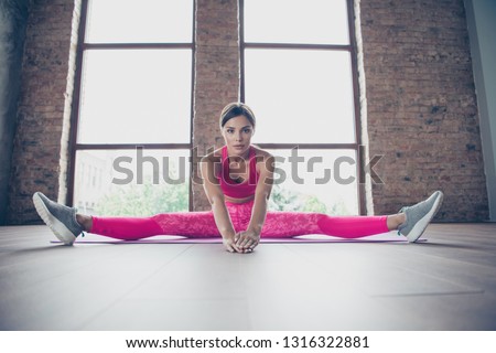 Portrait of her she nice attractive charming sportive thin focused concentrated lady wearing pink clothes top sitting twine leaning towards in modern loft industrial interior style indoors